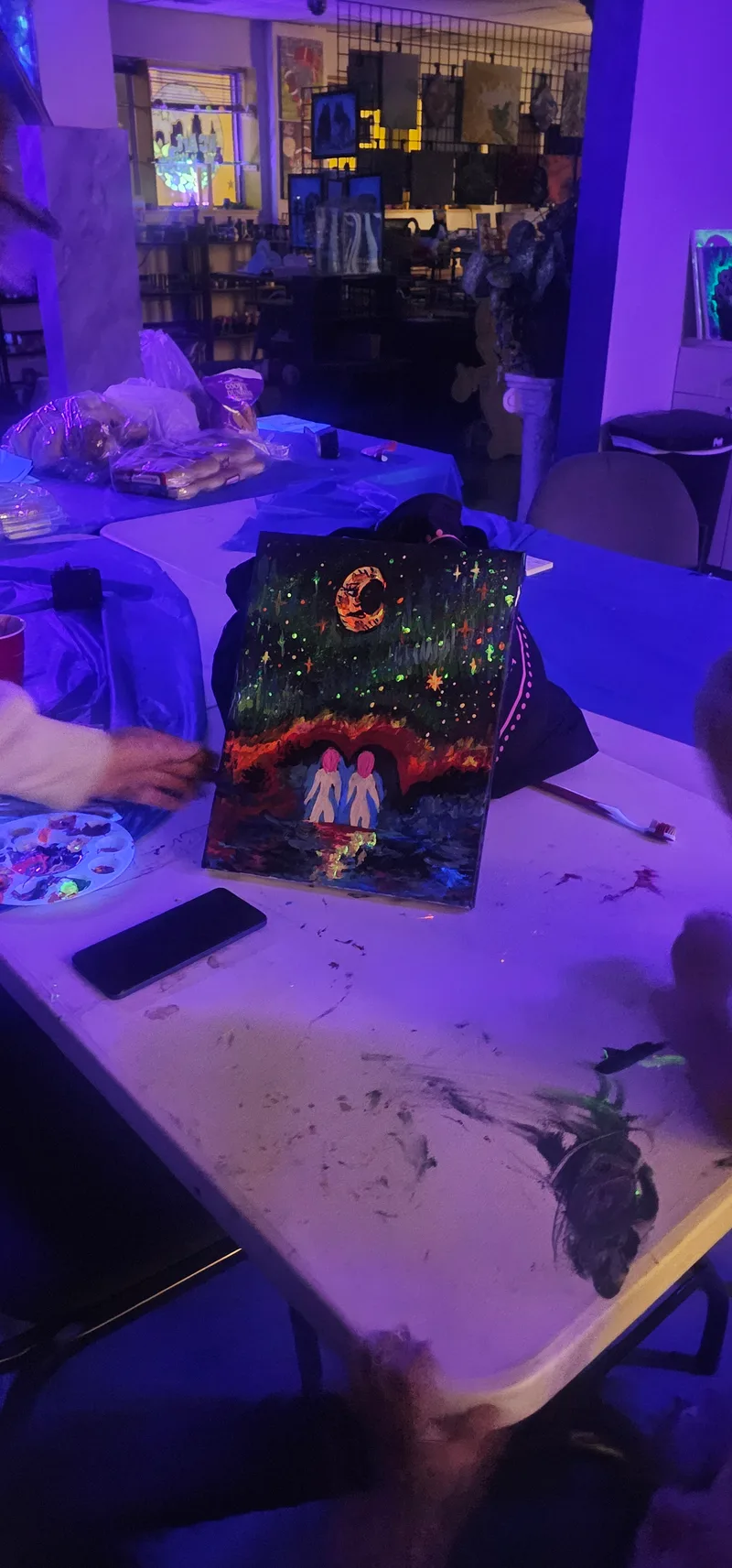 A glowing creature painted in UV-reactive colour