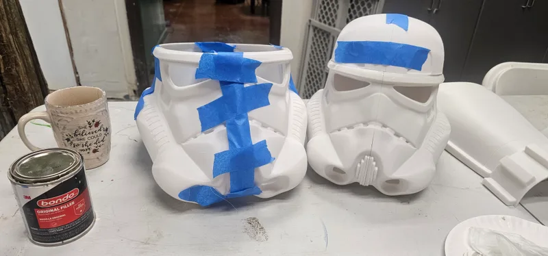 Cast plaster helmets primed and waiting to be painted